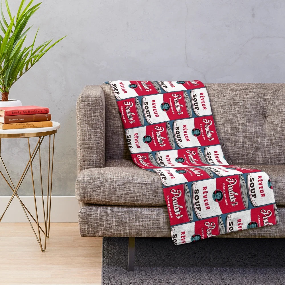 Dreamer-inspired plush blanket featuring the character Poulain from the French film "Amelie" and pop art style Campbells soup can