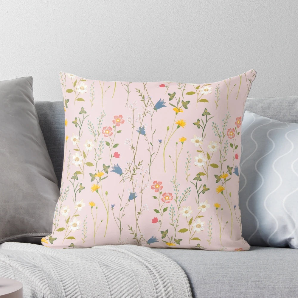 A soft, plush pillow featuring a beautiful floral pattern in vibrant colors, perfect for adding a touch of boho charm to your summer home decor.