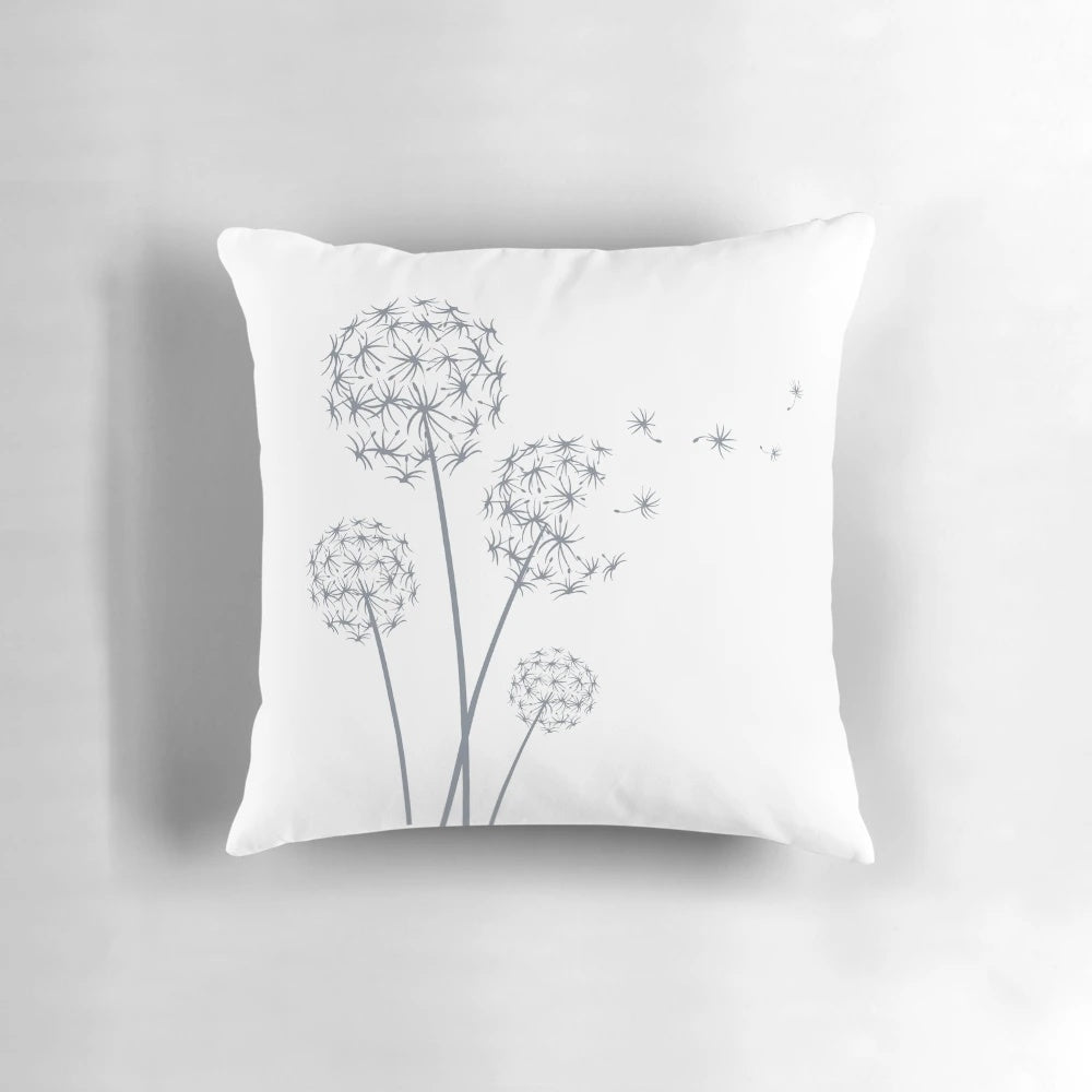 Soft, fluffy white pillow featuring a vibrant dandelion design - perfect for spring and summer decor.