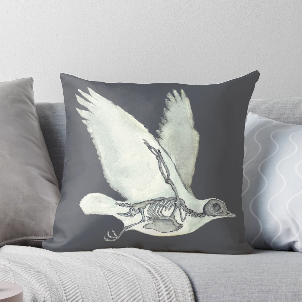 Detailed watercolor illustration of a bird skeleton or dove anatomy on a decorative throw pillow.