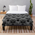 Damask skull pattern plush blanket in a gothic style