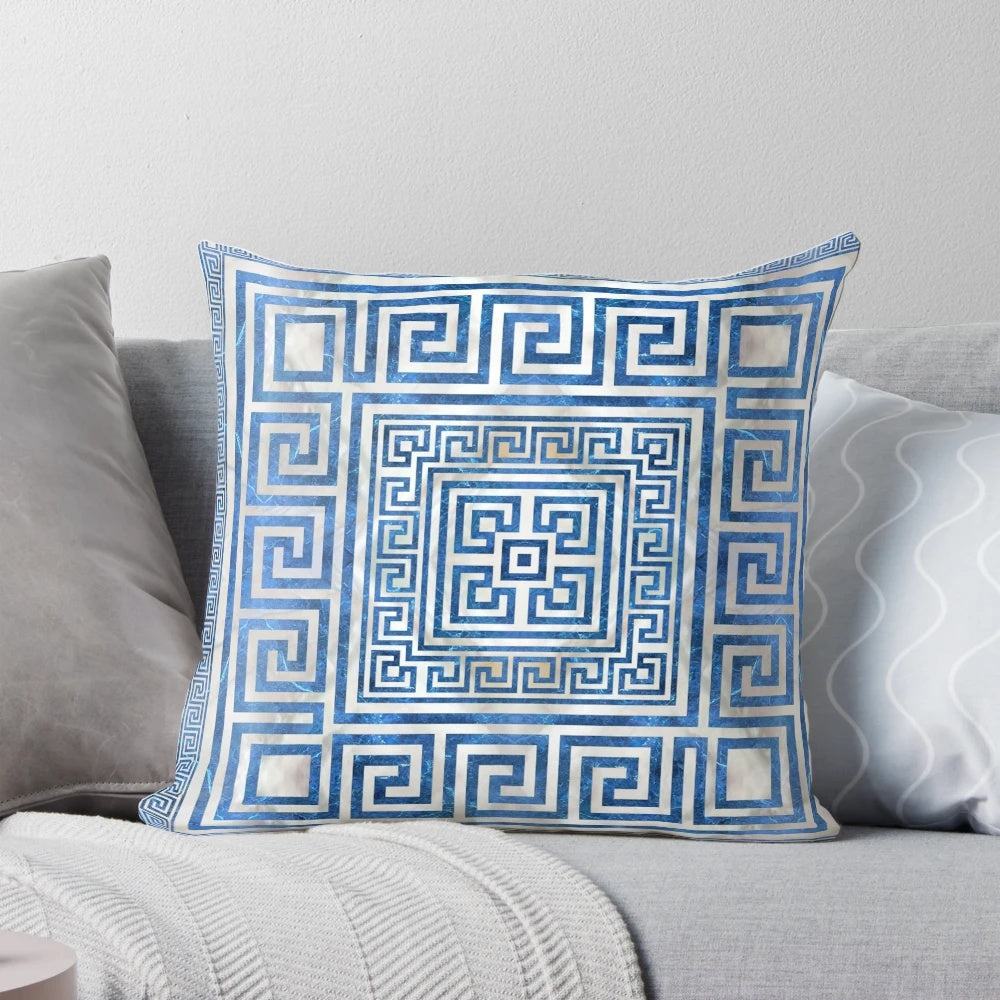 Greek key pattern and meander design printed on a blue marble-inspired square pillow