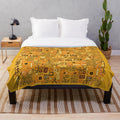 Klimt-inspired plush blanket with intricate golden pattern