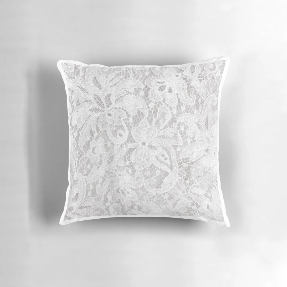 Luxurious white lace pillow with intricate floral embroidery, perfect for wedding and home decor