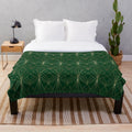 Emerald green plush blanket with art deco geometric pattern