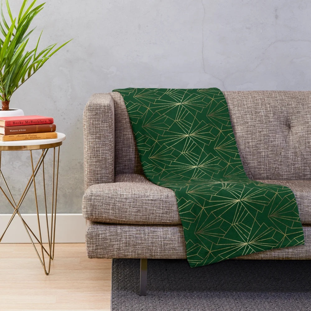 Emerald green plush blanket with art deco geometric pattern