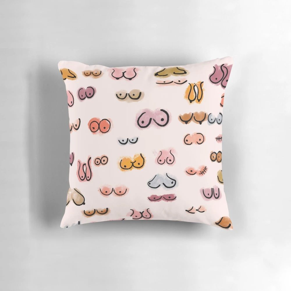 A decorative watercolor throw pillow featuring a whimsical boobs design in soft pastel tones.