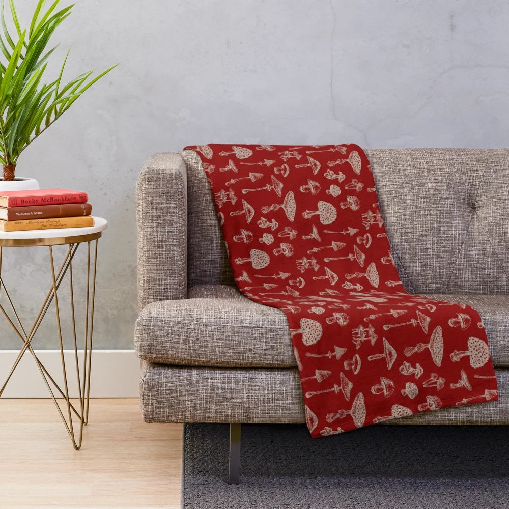 Soft and cozy plush blanket with whimsical forest and mushroom design