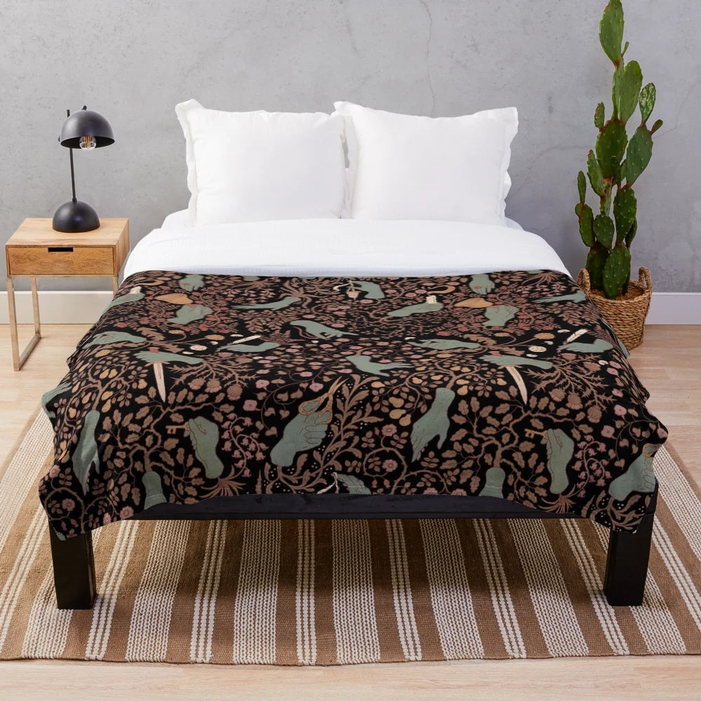 Plush blanket with an enchanted hand pattern design
