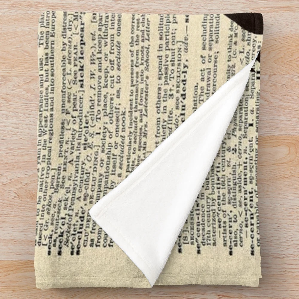 Peter Pan-inspired plush blanket featuring a vintage dictionary page design