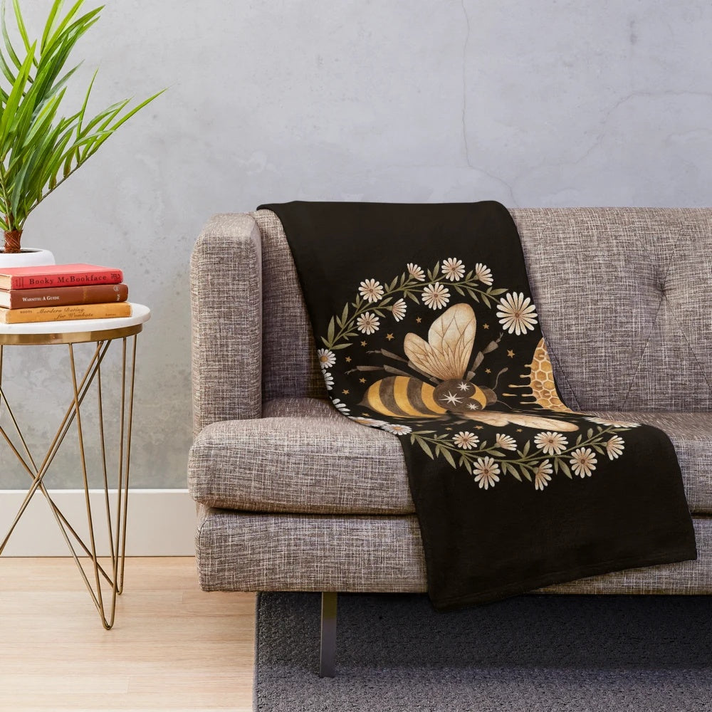 Cozy plush blanket featuring a magical moon and honeycomb design