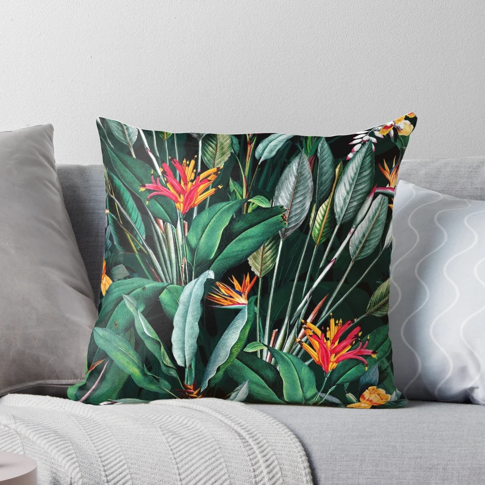 Vintage botanical print pillow with lush tropical leaves and floral motifs.