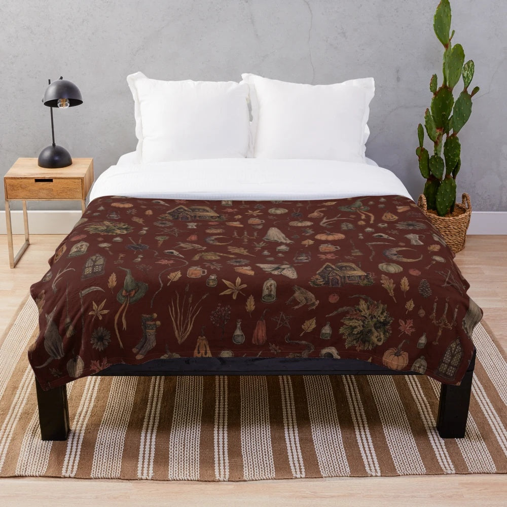 Cozy plush blanket with witchy, autumn-inspired design