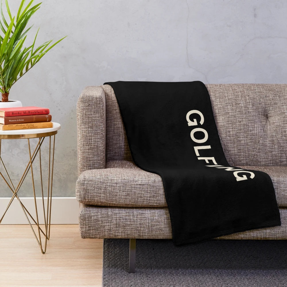 Plush blanket with golf-themed design featuring golf ball, club, and course