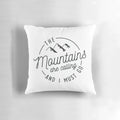 A vintage-style pillow featuring a mountain range and the text "The Mountains Are Calling And I Must Go