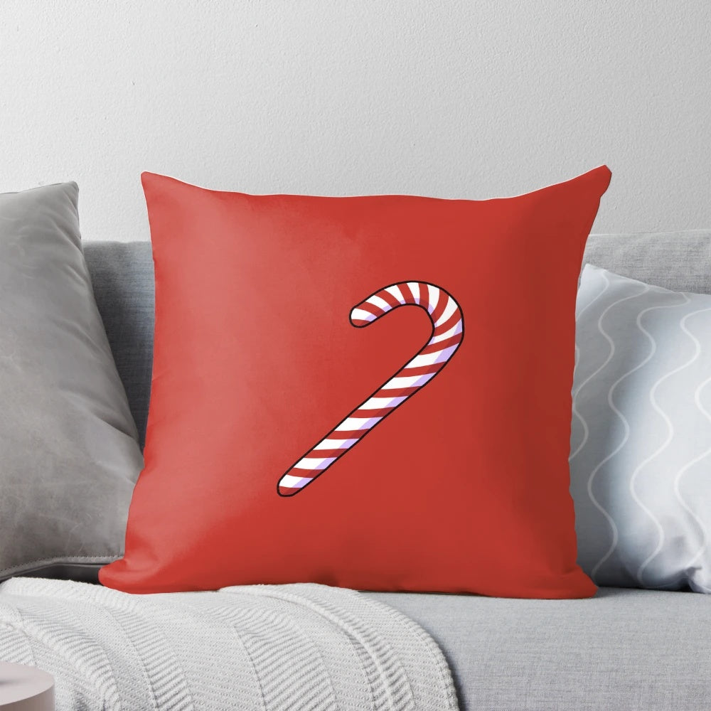 Decorative holiday pillow with a festive candycane design in red and white