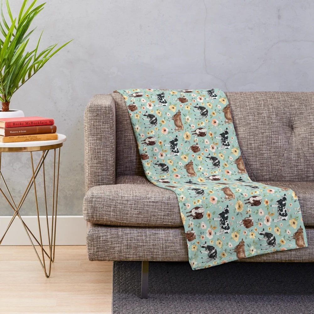 Plush cow blanket with floral watercolor design