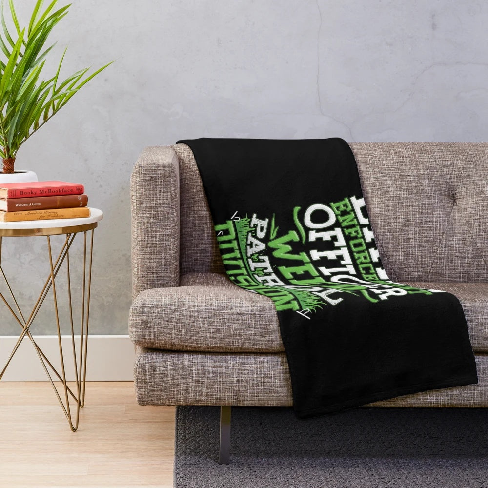 Plush blanket featuring a funny "Lawn Enforcement Officer" design for gardening enthusiasts