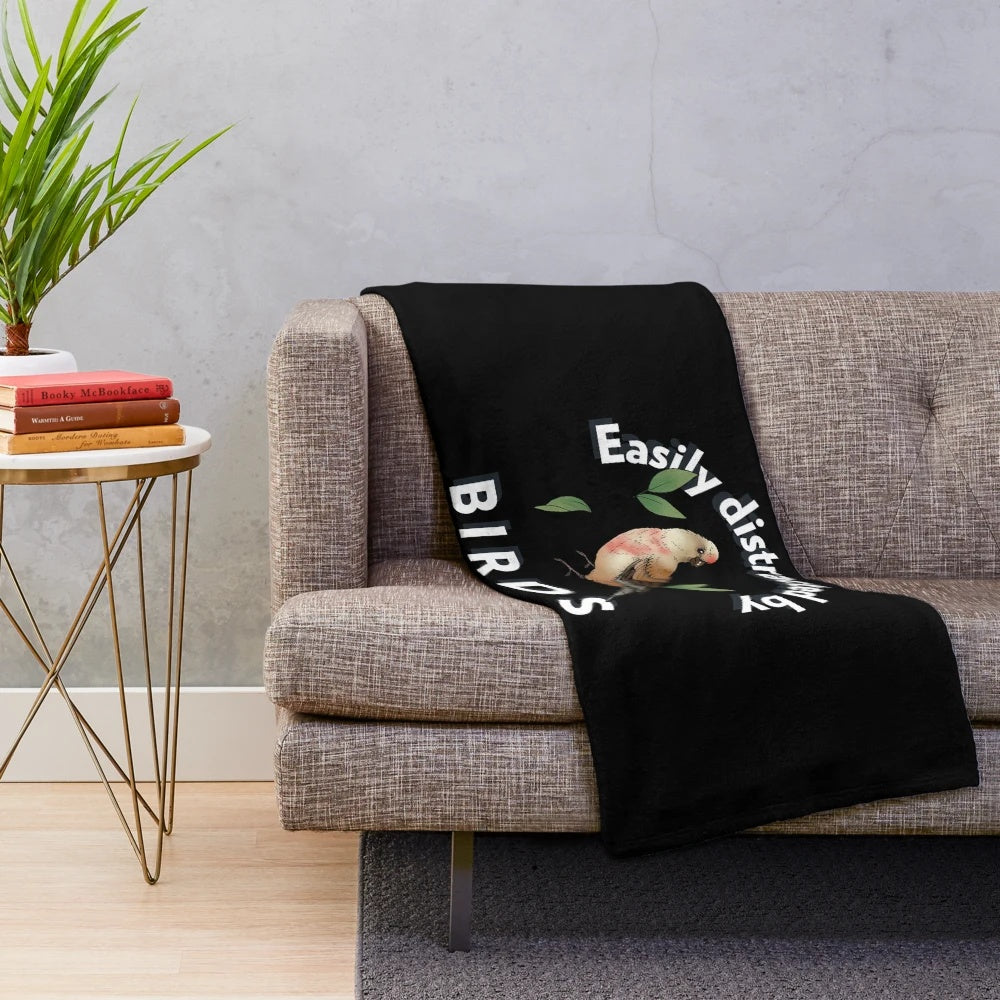 Plush blanket with a funny "easily distracted by birds" design for bird watching enthusiasts