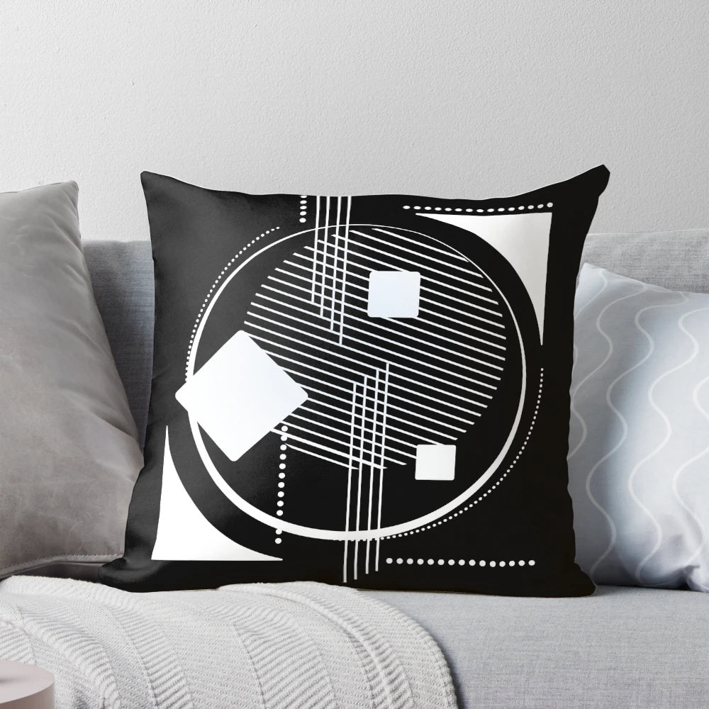 Geometric abstract black and white pillow with a modern Scandinavian design featuring hexagons, triangles, and lineart.
