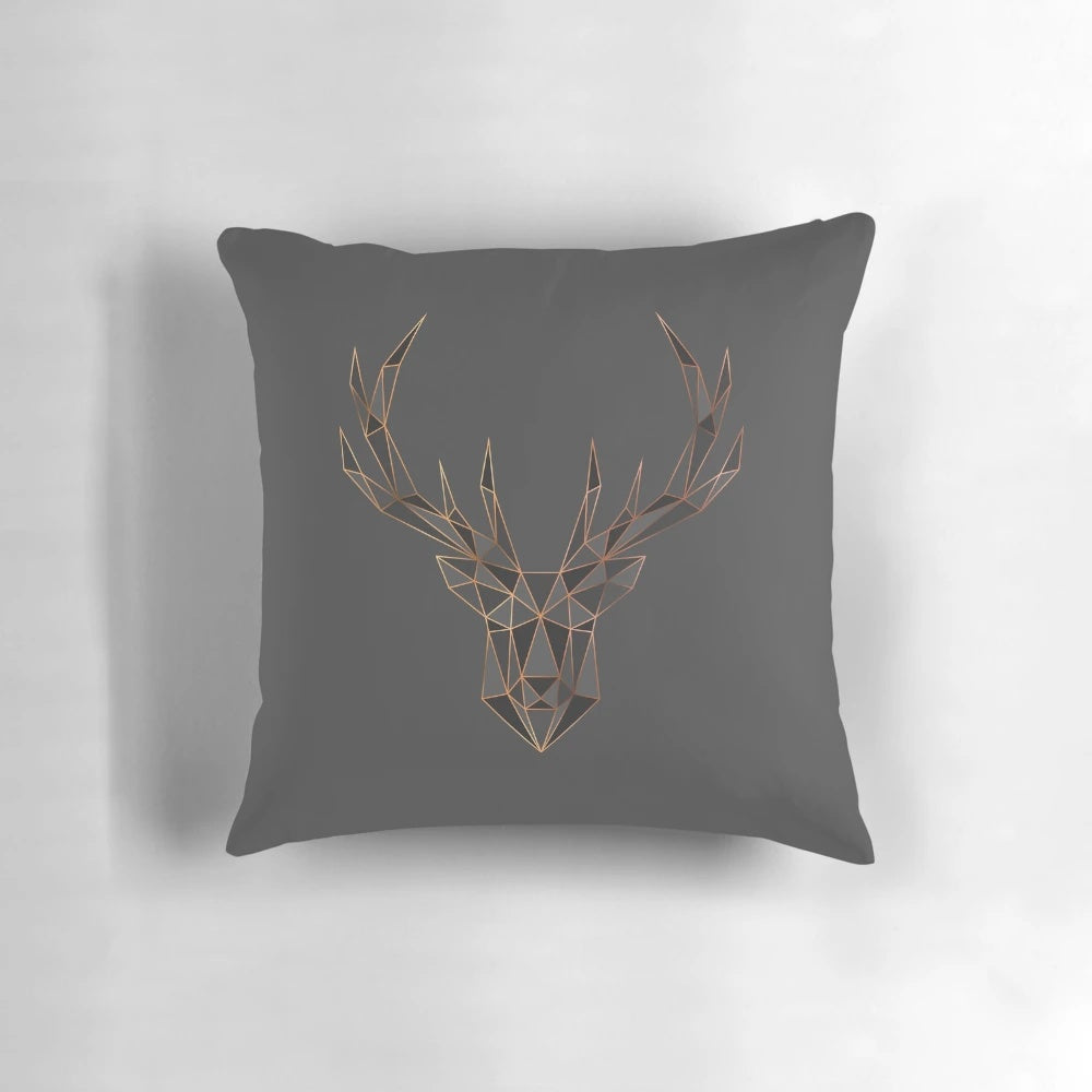 Geometric staggered deer head design pillow with metallic and polygon elements