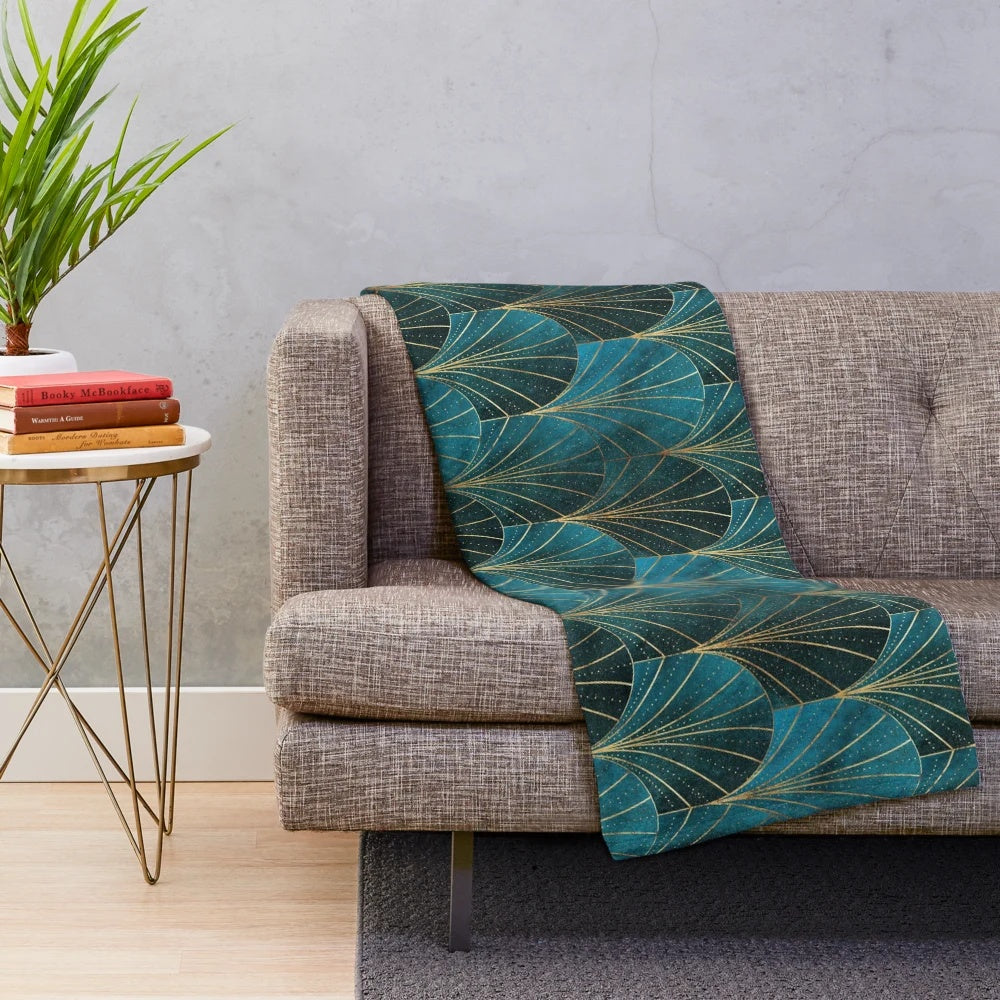 Teal plush blanket with textured art deco waterfall pattern