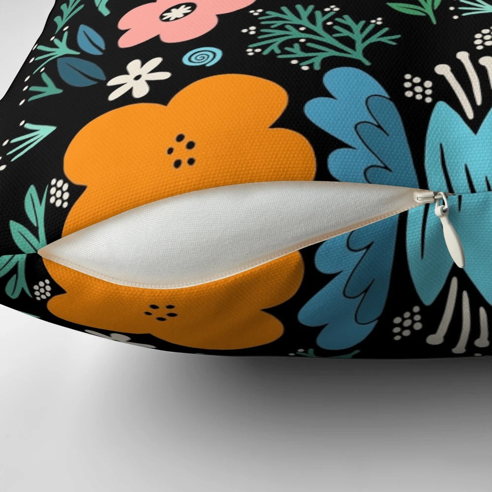 A decorative pillow featuring a garden-inspired floral typography design with a growth-focused quote.