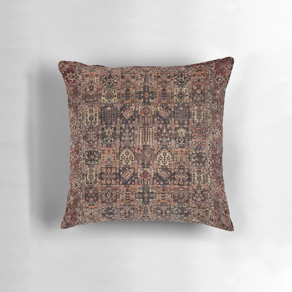 Decorative vintage-style Persian carpet pillow with intricate floral and geometric patterns