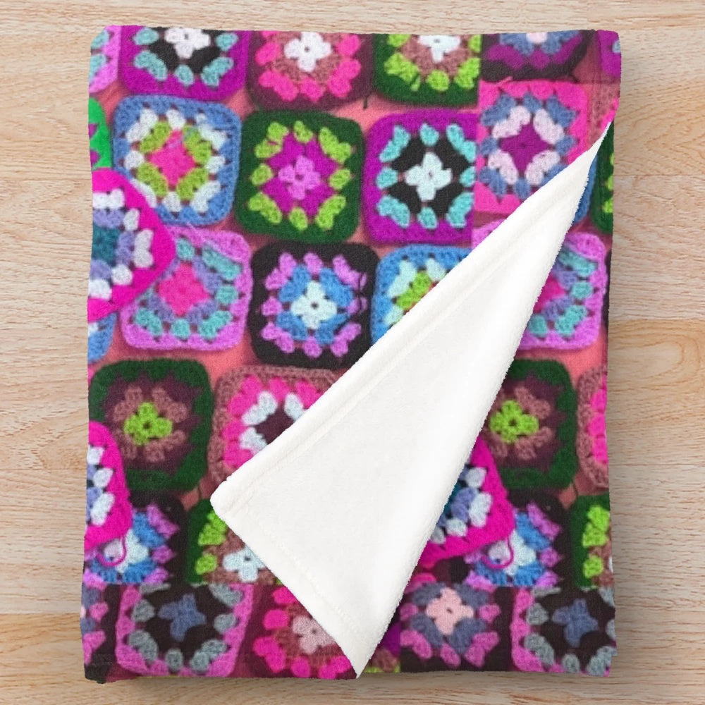 Colorful vintage-style crochet blanket with granny square pattern