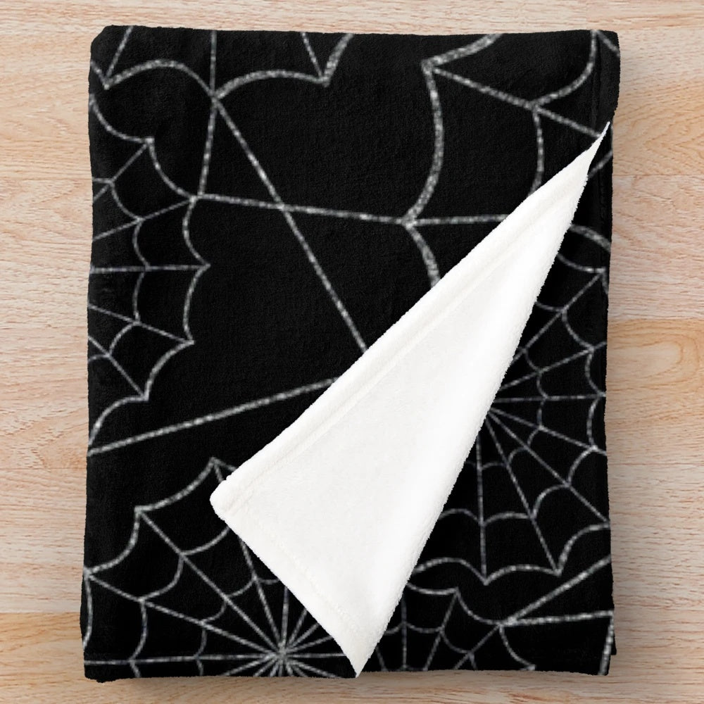 Spider web patterned plush blanket for spooky home decor