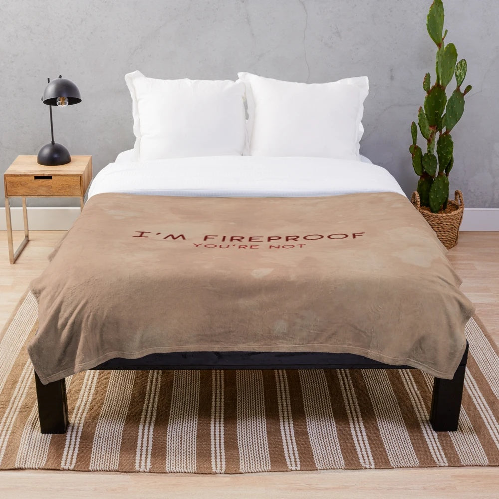 Hellboy-inspired fireproof plush blanket with demon and typography design