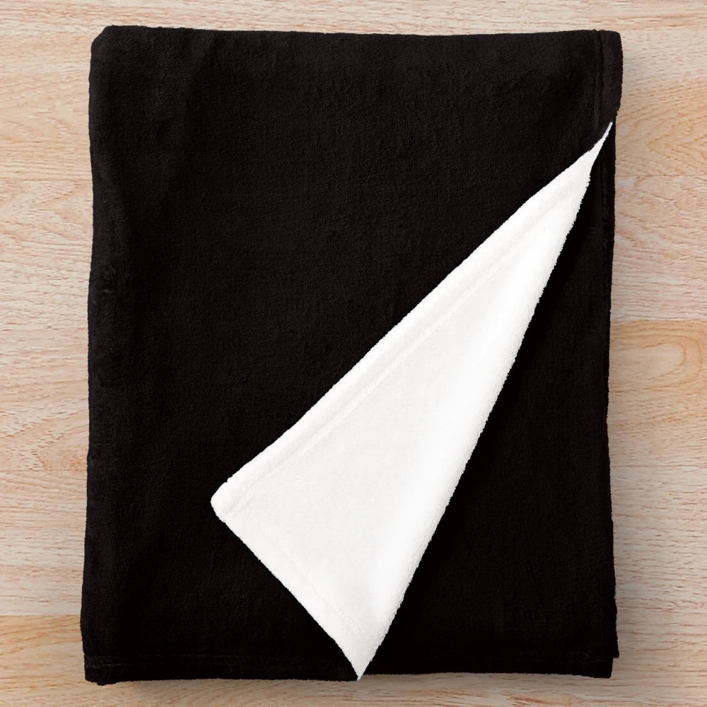 Plush blanket with the phrase "If you assume, you make an ASS of U and ME" against a black background