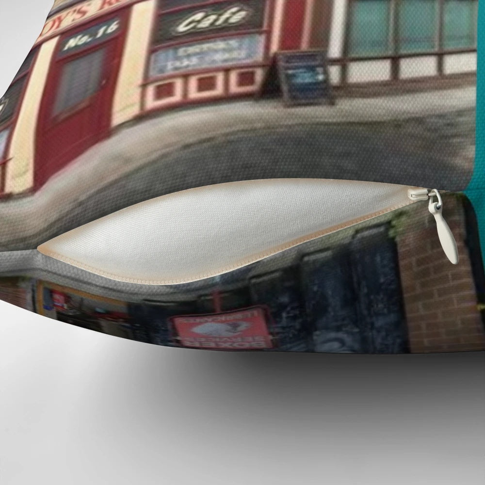 Corrie pillow featuring iconic buildings from Coronation Street