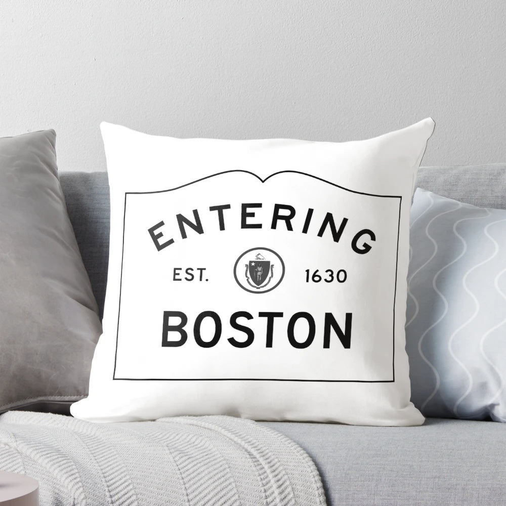 Entering Boston sign in front of a red and white brick building