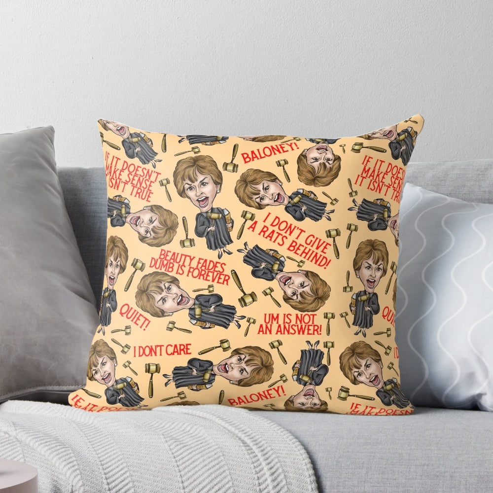 An orange throw pillow featuring a stylized image of TV personality Judge Judy, perfect for pop culture enthusiasts.
