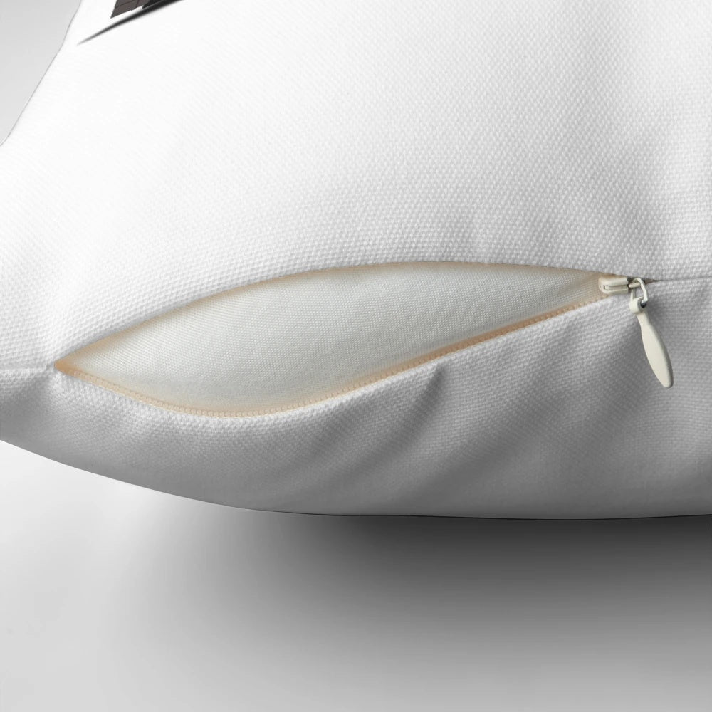 Pillow featuring an illustration of a classic Toronto streetcar in red, white, and grey.