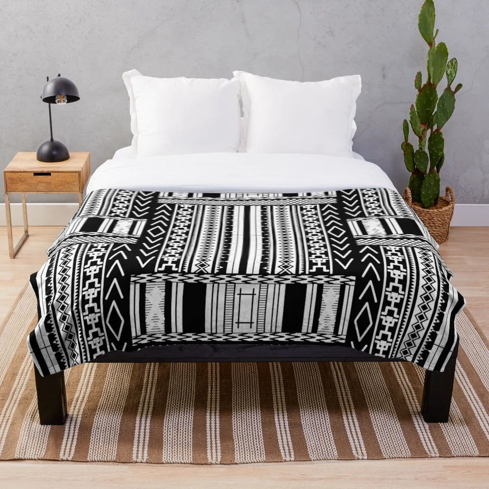 Ifugao-inspired black and white plush blanket with unique tribal patterns