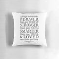 Black and white throw pillow with the text "You are braver than you believe" in a stylized font.