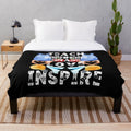 Plush blanket with text "teach love inspire" and "the future of the world is in my classroom