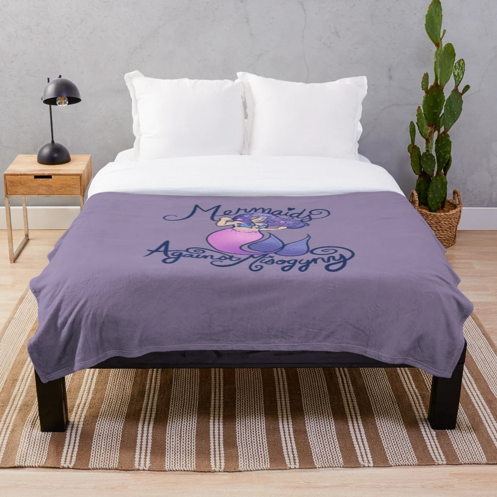Soft and cozy mermaid plush blanket featuring a feminist design