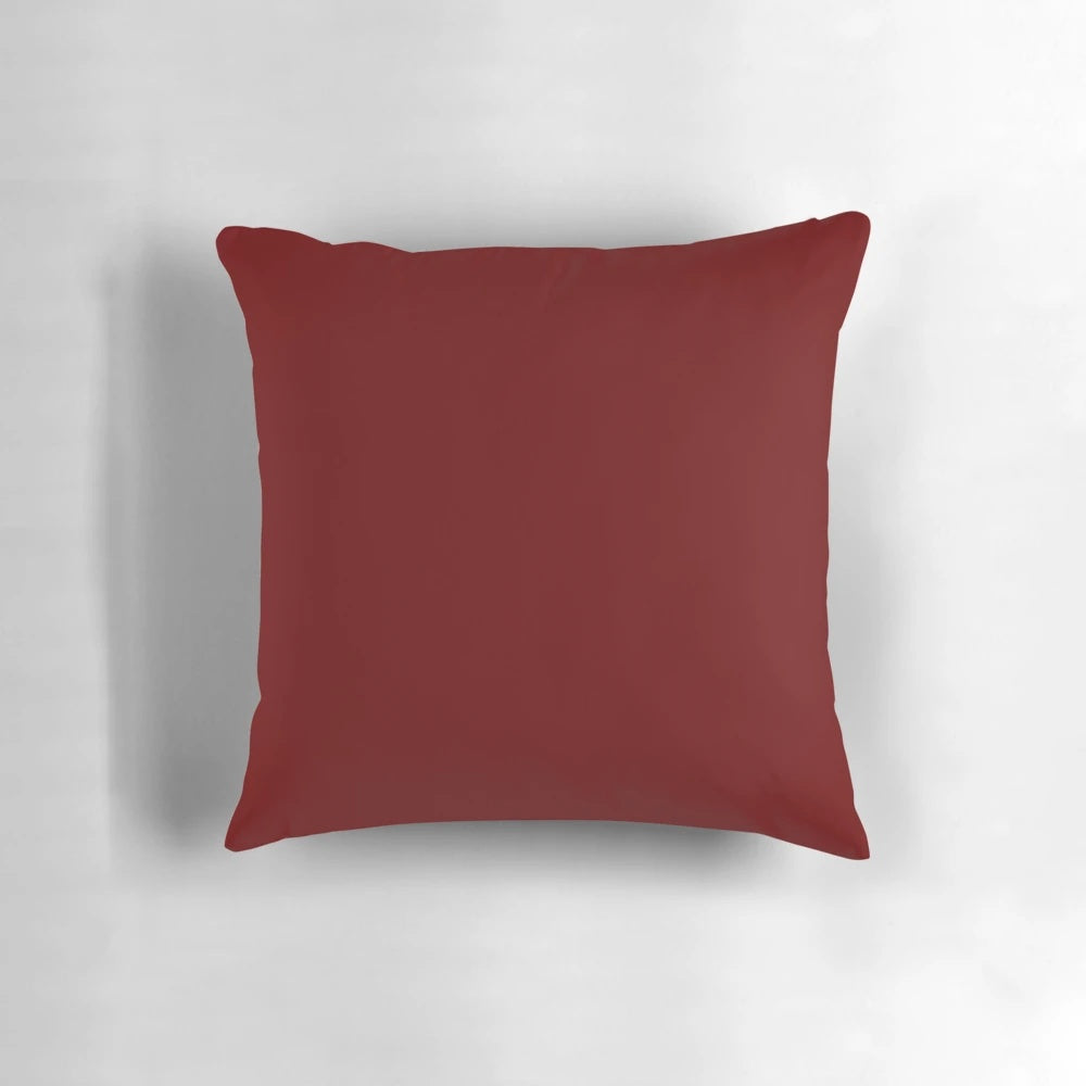 Burgundy red solid color decorative pillow with a minimalist, elegant design