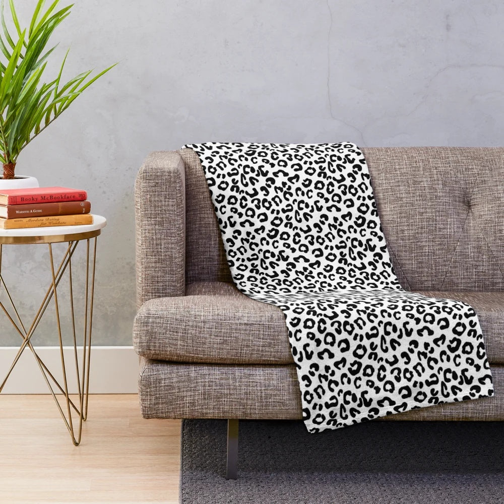 Soft and cozy cheetah print plush blanket in black and white