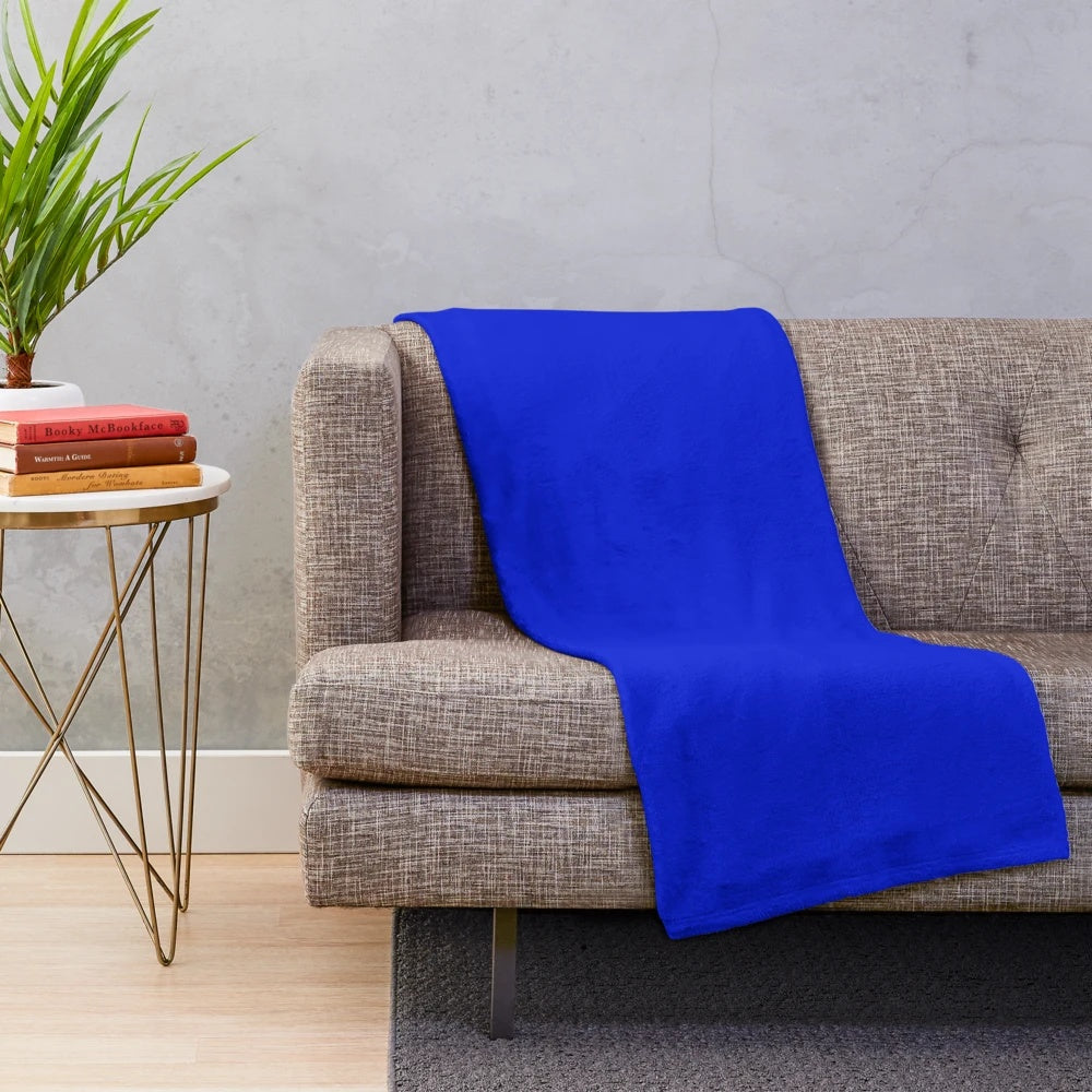 Cobalt blue plush blanket with a soft, vibrant hue