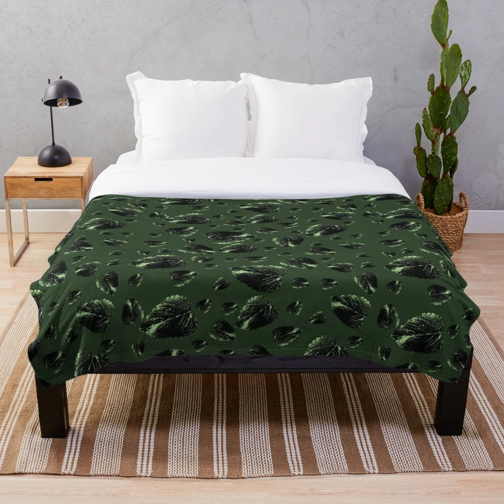 Forest green velvet plush blanket with botanical leaf pattern