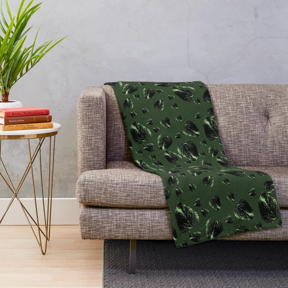Forest green velvet plush blanket with botanical leaf pattern