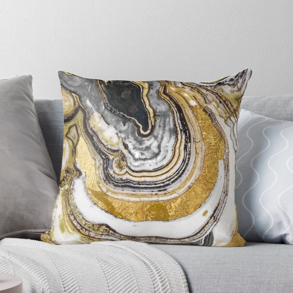 Cozy gold and black stone-like patterned pillow with a natural, geode-inspired design.