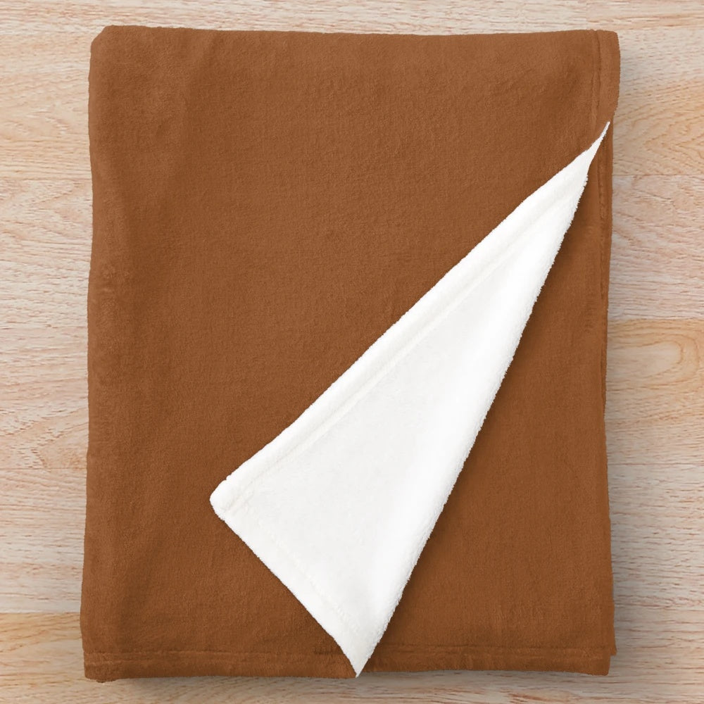 Sugar almond colored plush blanket with a cozy and soft texture