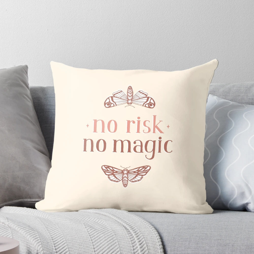 A decorative throw pillow featuring a handlettered "No Risk No Magic" quote with whimsical moth and butterfly illustrations.