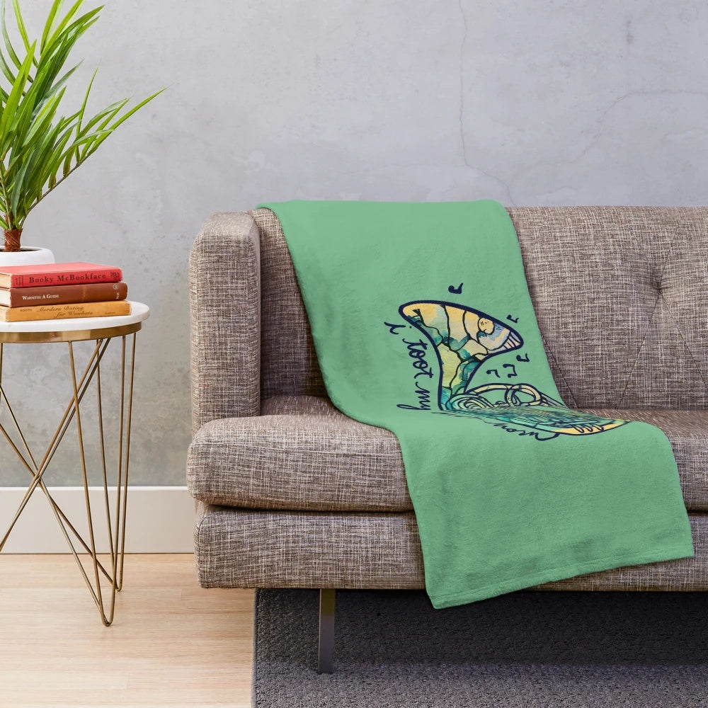 Cozy plush blanket featuring a french horn design for music lovers