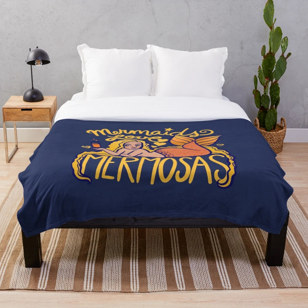 Mermaid-themed plush blanket with mermaids and mimosas